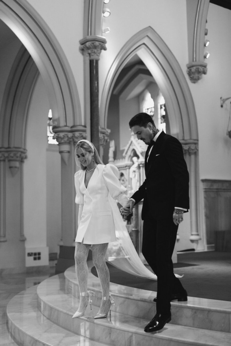 Bride and groom walking down steps stairs