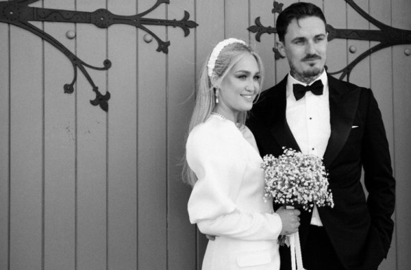 Wedding couple outside church venue short wedding dress bride and groom close up flowers bouquet