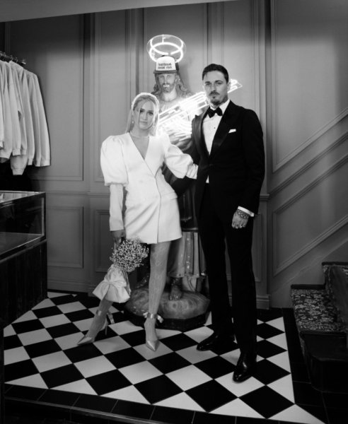 Wedded couple bride and groom beside holy statue Jesus Christ tiles floors