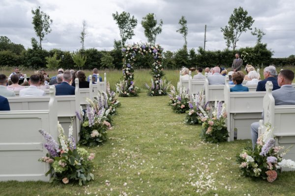 Wedding seated seated area for guests flowers