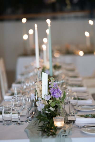 Empty dining room table candles lit cutlery