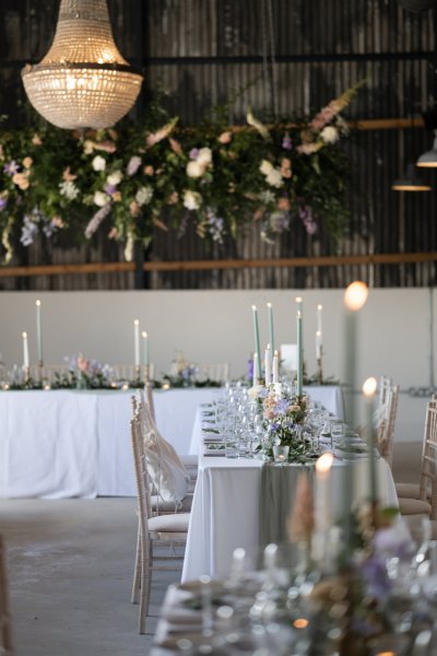 Empty dining room table with candles white roses