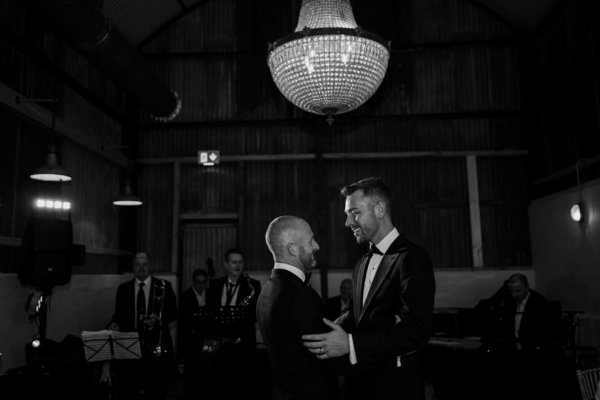 Groom and groom first dance dancing black and white