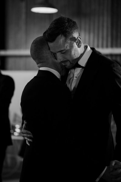 Groom and groom first dance dancing black and white