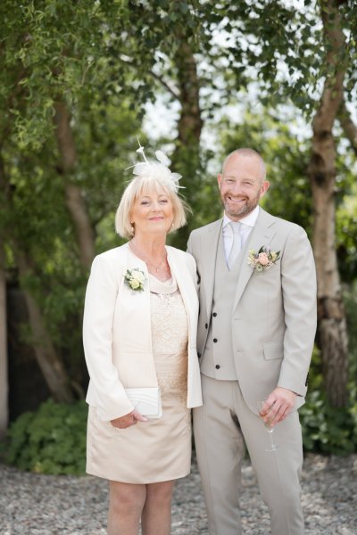 Mother and son groom