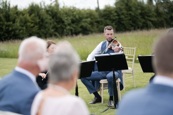 Wedding band musicians playing violin