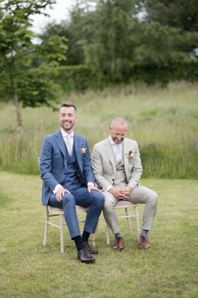 Groom and groom sitting down during wedding ceremony