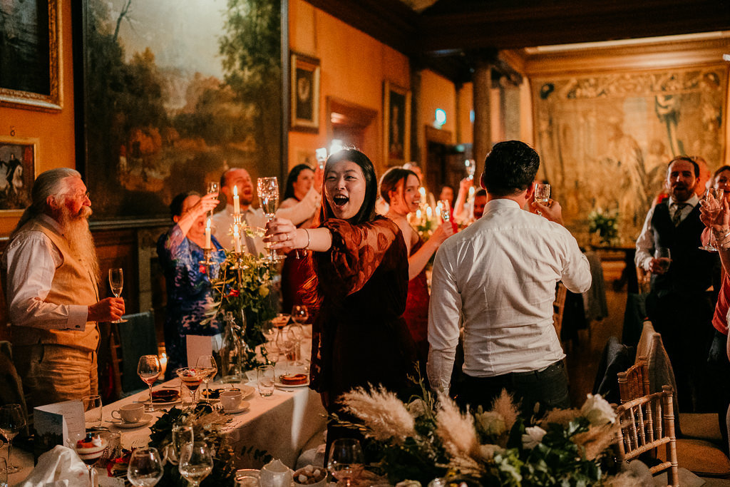 guest does yam seng toast at irish wedding