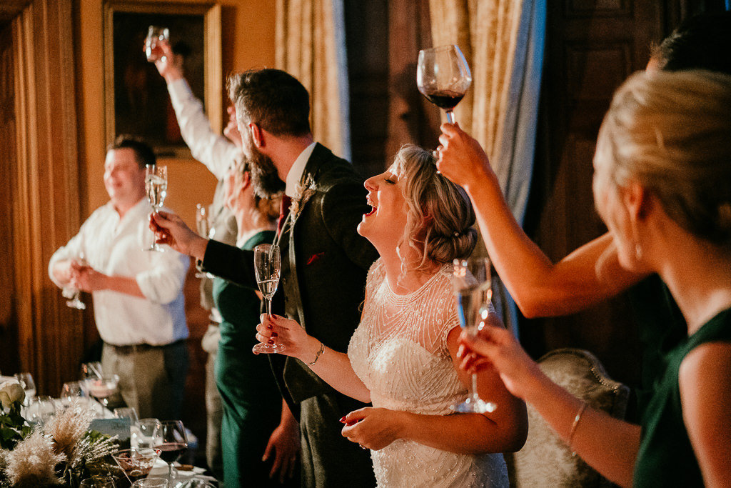 Couple do yam seng toast at irish wedding