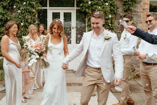 bride and groom ceremony outdoors confetti