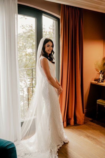 Bride on her own at window