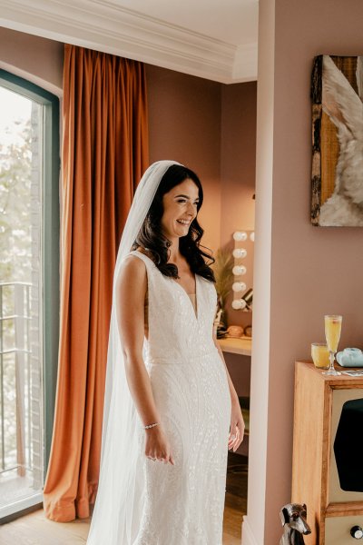 Bride on her own at window