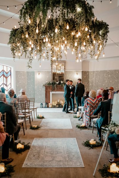 Groom and groomsmen wait on bride