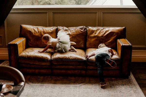 Little baby girl wearing ballerina dress on couch sofa