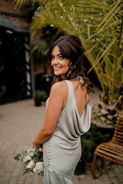 Bridesmaid wearing satin gown