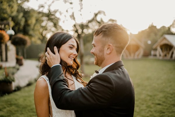 Bride and groom embrace