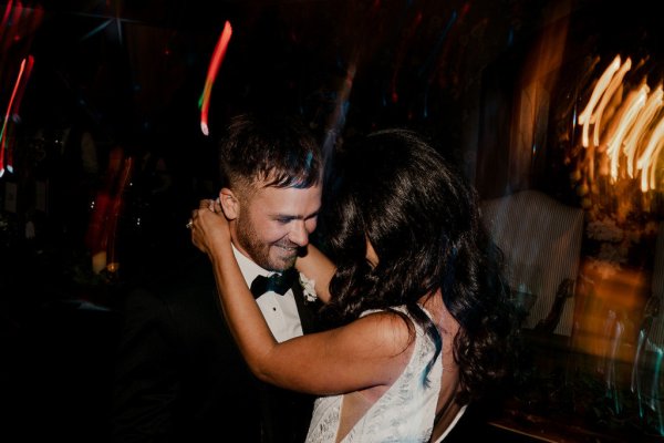 Bride and groom dance on dancefloor