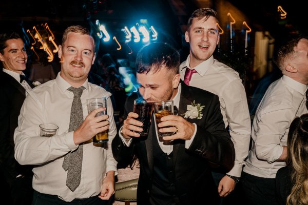 Guests drinking beer on dancefloor