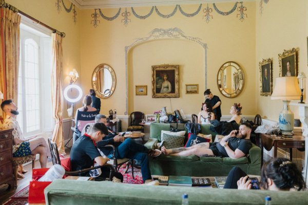 Groomsmen relaxing in room getting ready