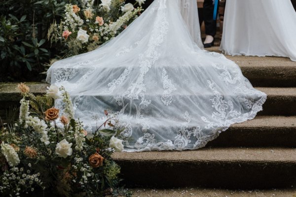 Long dress train lace gown bridalwear steps flowers