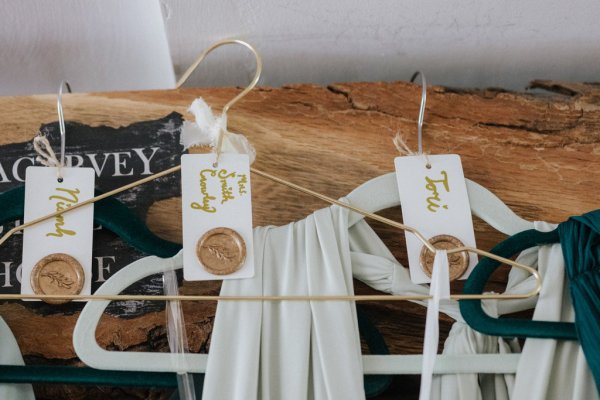 Hangers hanging dresses up