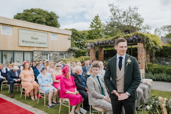 Groom waits for bride at alter