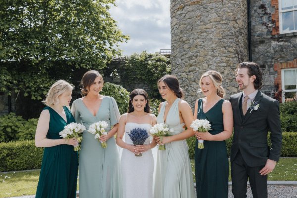 Bride and bridesmaids holding flowers