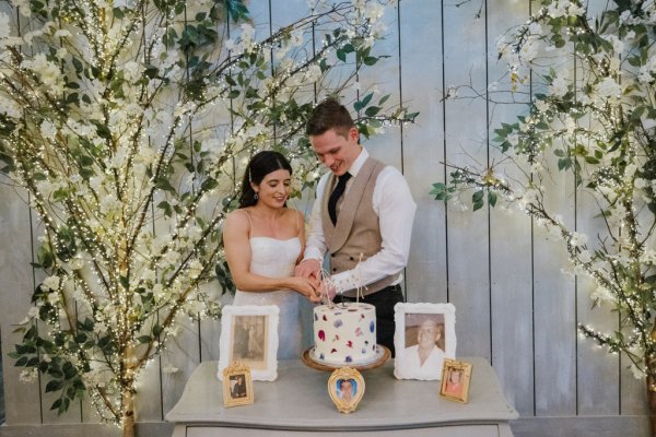 Bride and groom cut cake