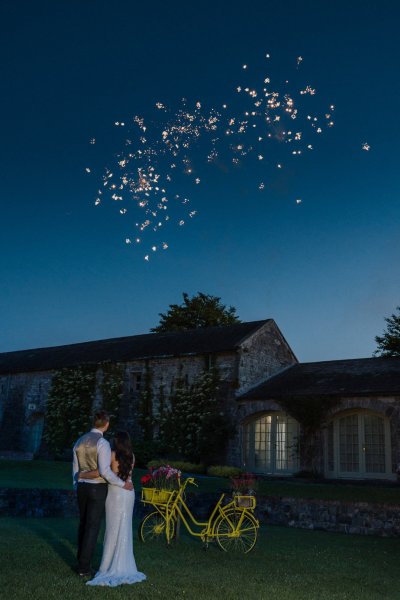 Bride and groom evening shot sky fireworks