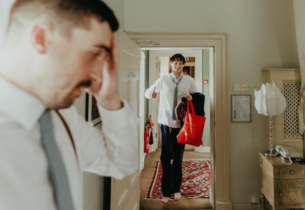 Groomsman and groom