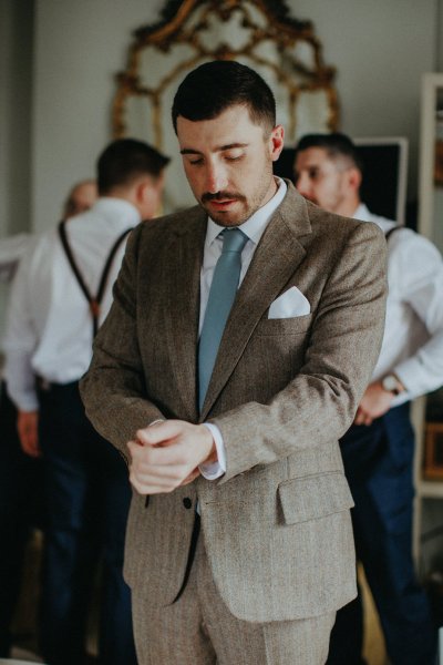 Groom getting ready suit tweed jacket