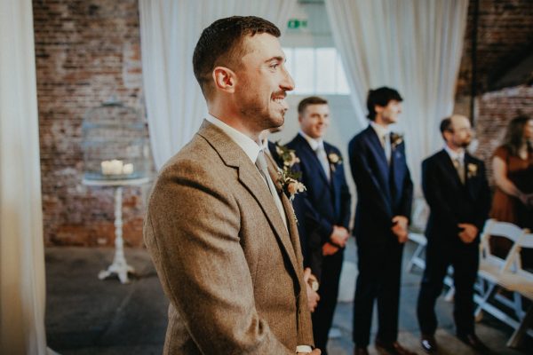 Groom and groomsmen smiling