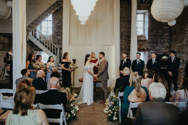 Bride with groom at alter priest ceremony