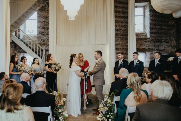 Bride with groom at alter priest ceremony