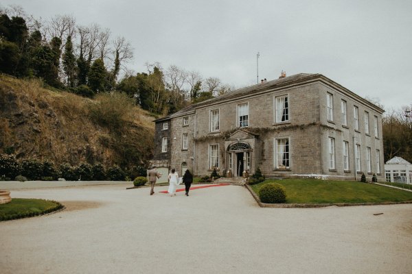 Bride and groom outside of wedding venue