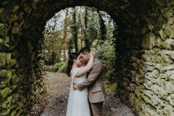 Bride and groom exterior forest park hideaway oval archway