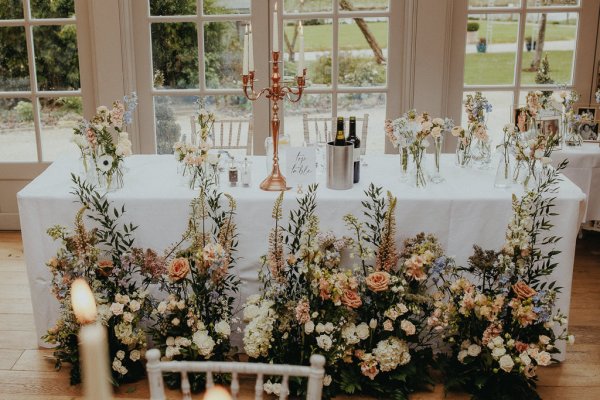 Bouquet of flowers surrounding white table