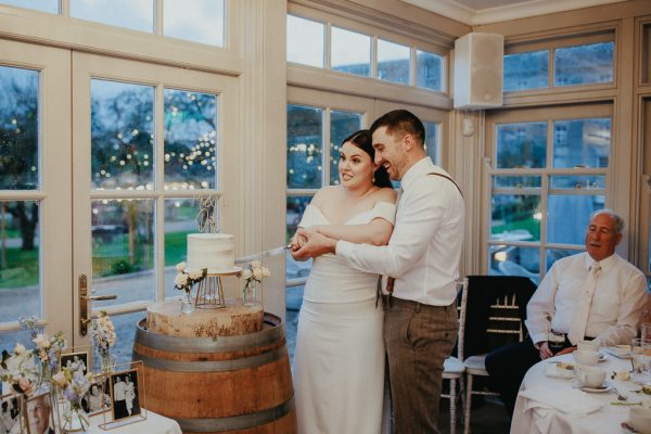 Bride and groom cut the cake