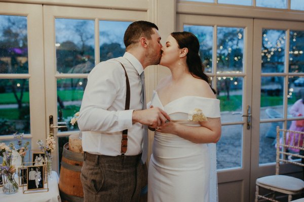 Bride and groom kiss kissing