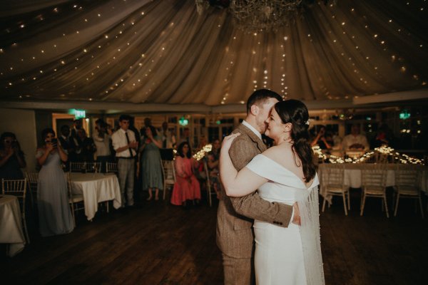 Dancefloor bride and groom marquee lights dancing