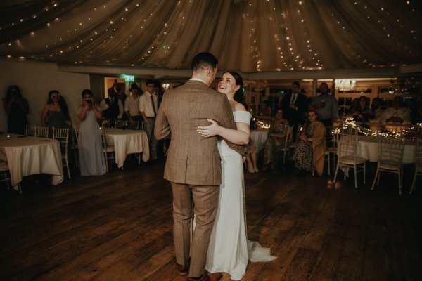 Dancefloor bride and groom marquee lights dancing