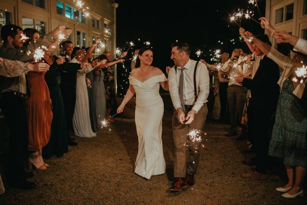 Dancefloor bride and groom marquee lights sparklers