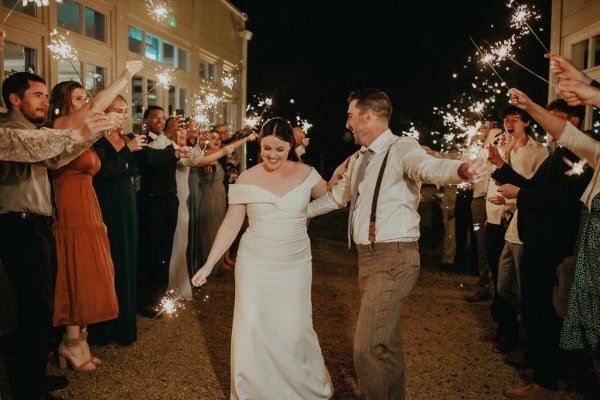 Dancefloor bride and groom marquee lights sparklers