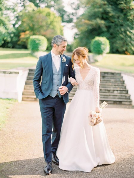 Bride and groom steps in background