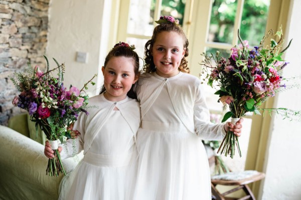 Flower girls holding bouquet of flowers