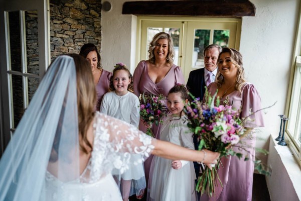 Bridesmaids and flower girls waiting on bride