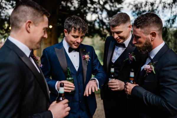 Groom groomsman drinking beer