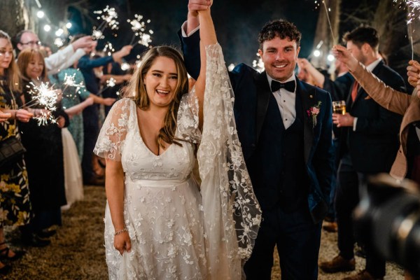 Bride and groom hands in the air