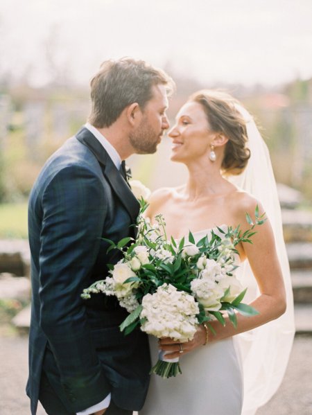 Bride and groom photography white bouquet of flowers