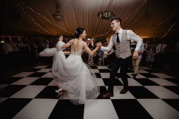 Bride and groom dancing on dancefloor